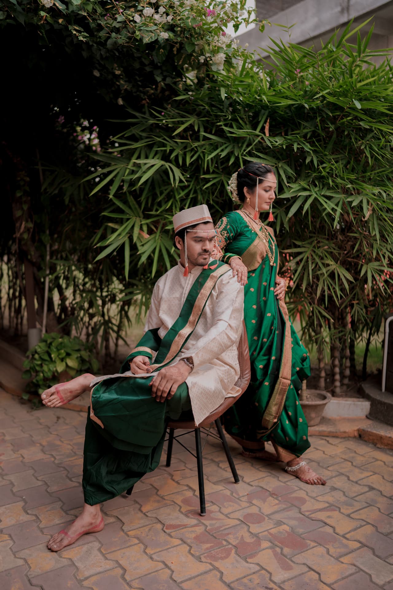 A bride and groom in traditional wedding attire photographed by Epic Studioz